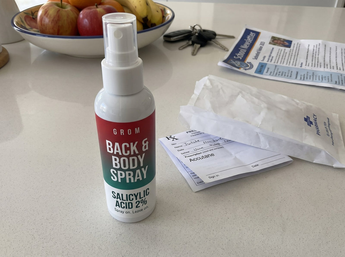 Grom spray on the kitchen bench next to an unfilled Accutane prescription