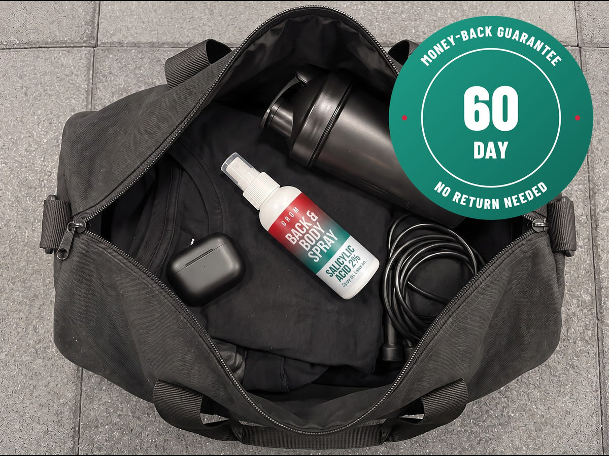 A bottle of Grom back and body spray lying in an open black gym bag with a 60-day money-back guarantee badge
